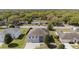 An aerial view of the property shows a well-maintained lawn and beautiful curb appeal at 6087 Sunset Vista Dr, Lakeland, FL 33812