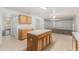 Open kitchen with island and plenty of cabinet space for storage and functionality at 6087 Sunset Vista Dr, Lakeland, FL 33812