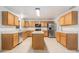 Well-equipped kitchen features stainless steel appliances, an island and ample counter space at 6087 Sunset Vista Dr, Lakeland, FL 33812