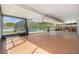 Large covered patio leads out to the screened-in pool and patio area, great for relaxing and entertaining at 6087 Sunset Vista Dr, Lakeland, FL 33812