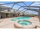 A private in-ground pool and jacuzzi in a screened enclosure are perfect for relaxation and entertainment at 6087 Sunset Vista Dr, Lakeland, FL 33812