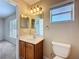 Bathroom features a vanity sink, and a mirror at 703 New York Ave, South Daytona, FL 32119