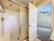 Bathroom features a walk-in shower and a view to the bedroom at 703 New York Ave, South Daytona, FL 32119