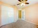 This bedroom features a closet and door at 703 New York Ave, South Daytona, FL 32119