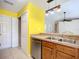 Well-lit kitchen with wooden cabinets, stainless steel appliances, and a view into the open living space at 703 New York Ave, South Daytona, FL 32119
