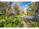 A spacious backyard with mature trees and green grass perfect for outdoor activities at 9401 Cat Track Trl, Lake Wales, FL 33898
