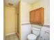 Compact bathroom features a tiled shower and built-in storage at 9401 Cat Track Trl, Lake Wales, FL 33898