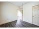 Bright bedroom featuring laminate floors and a closet at 9401 Cat Track Trl, Lake Wales, FL 33898