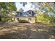 Exterior of the two-story home showcasing its private setting in a lush, serene environment at 9401 Cat Track Trl, Lake Wales, FL 33898