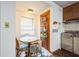 View of a small kitchen featuring a breakfast nook and wood cabinets at 9401 Cat Track Trl, Lake Wales, FL 33898