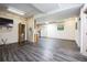 Open-concept living room with laminate floors and access to the kitchen at 9401 Cat Track Trl, Lake Wales, FL 33898