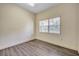 Cozy room featuring hardwood flooring and a bright window at 9401 Cat Track Trl, Lake Wales, FL 33898