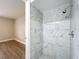 Shower with decorative tile walls, new fixtures, and natural light at 3322 Heather Glynn Dr, Mulberry, FL 33860