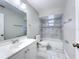 Bathroom with a modern vanity, updated fixtures, and decorative tile at 3322 Heather Glynn Dr, Mulberry, FL 33860