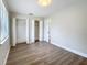 Bedroom boasts wood-look floors, a window for natural light, and a closet at 3322 Heather Glynn Dr, Mulberry, FL 33860