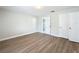 Large bedroom features new flooring, closet space, and an attached bathroom at 3322 Heather Glynn Dr, Mulberry, FL 33860