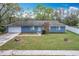 Charming single-Gathering home with a well-maintained lawn, attached garage, and neutral paint, ready for personalization and move-in at 3322 Heather Glynn Dr, Mulberry, FL 33860
