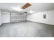 Spacious garage with an automatic door opener and access to an attic storage space at 3322 Heather Glynn Dr, Mulberry, FL 33860