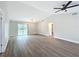 Spacious living room features updated flooring, neutral paint, and a sliding glass door at 3322 Heather Glynn Dr, Mulberry, FL 33860
