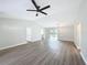 Bright living room features vaulted ceilings, a ceiling fan, and sliding glass doors to the backyard at 3322 Heather Glynn Dr, Mulberry, FL 33860