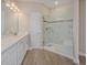 Elegant bathroom with a glass-enclosed shower, tile flooring, and modern vanity at 7517 Laureate Blvd # 4303, Orlando, FL 32827