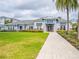 Inviting community clubhouse with a well-manicured lawn and attractive landscaping at 7517 Laureate Blvd # 4303, Orlando, FL 32827