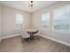 Cozy dining area with lots of light from the three windows at 7517 Laureate Blvd # 4303, Orlando, FL 32827
