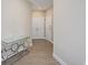 Inviting hallway features stylish floors, a sleek console table, and ample natural light at 7517 Laureate Blvd # 4303, Orlando, FL 32827