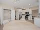 Stylish kitchen with stainless steel appliances, white cabinets, and a pantry for extra storage space at 7517 Laureate Blvd # 4303, Orlando, FL 32827