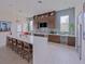 Modern kitchen featuring a long island counter with seating, updated appliances and sleek cabinetry at 7517 Laureate Blvd # 4303, Orlando, FL 32827
