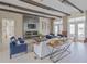 Beautiful living room features a fireplace, modern decor, with wood beam and plenty of natural light at 7517 Laureate Blvd # 4303, Orlando, FL 32827
