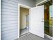 Exterior storage area featuring a water heater, accessible through an open white door at 7517 Laureate Blvd # 4303, Orlando, FL 32827