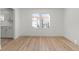 A cozy living room with hardwood floors illuminated by natural light from the windows at 1104 W 9Th St, Lakeland, FL 33805