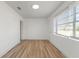 Bright living room features modern wood-look flooring and white walls with fresh paint at 1104 W 9Th St, Lakeland, FL 33805