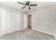 Neutral bedroom featuring a ceiling fan, carpeted floor, and closet at 1047 Aruba Ave, Mulberry, FL 33860