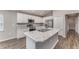 Modern kitchen with stainless steel appliances and granite countertops at 1047 Aruba Ave, Mulberry, FL 33860