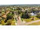 Aerial view of well-maintained community with lush landscaping, serene ponds, and charming residential streets at 11321 Ledgement Ln, Windermere, FL 34786