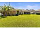 Beautiful backyard with well-maintained lawn and mature trees at 11321 Ledgement Ln, Windermere, FL 34786
