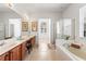 Bright bathroom featuring a walk-in shower, a soaking tub, and a dual sink vanity at 11321 Ledgement Ln, Windermere, FL 34786