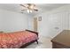 Bedroom with a fan and closet showcasing a bed with patterned bedding at 11321 Ledgement Ln, Windermere, FL 34786