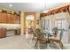 Eat-in kitchen area with a round table, ornate chairs, and lots of natural light at 11321 Ledgement Ln, Windermere, FL 34786