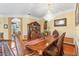 Formal dining room with a chandelier, wood table, and seating for six, perfect for entertaining at 11321 Ledgement Ln, Windermere, FL 34786