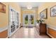 Inviting foyer with tile floors, chandelier and views of front yard through leaded glass front doors at 11321 Ledgement Ln, Windermere, FL 34786