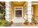 Inviting front entryway with double doors, decorative sidelights, and manicured landscaping at 11321 Ledgement Ln, Windermere, FL 34786