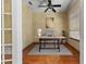Cozy home office with hardwood floors, natural light, and neutral-toned walls for a calming workspace at 11321 Ledgement Ln, Windermere, FL 34786