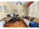 Functional home office featuring a large desk, comfortable seating, and ample natural light at 11321 Ledgement Ln, Windermere, FL 34786