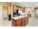 Kitchen with a large central island, stainless steel appliances, and seamless access to adjoining rooms at 11321 Ledgement Ln, Windermere, FL 34786