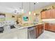 Kitchen with large granite island and dining area flowing into the living room for seamless entertaining at 11321 Ledgement Ln, Windermere, FL 34786