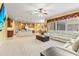 Bright and open floor plan featuring a casual living space with a stone-faced kitchen island at 11321 Ledgement Ln, Windermere, FL 34786