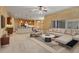 Staged open-concept living area featuring an island kitchen, modern sofa, and stylish decor at 11321 Ledgement Ln, Windermere, FL 34786